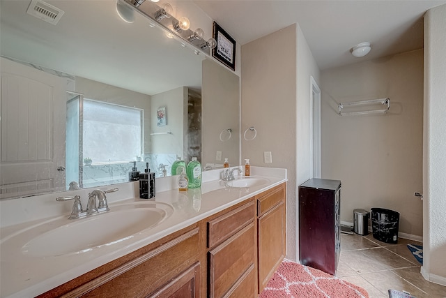 bathroom with vanity and tile patterned flooring