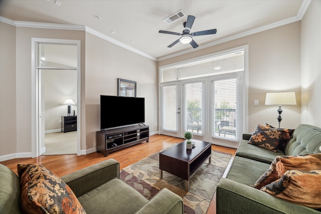 living room featuring crown molding, hardwood / wood-style flooring, and ceiling fan