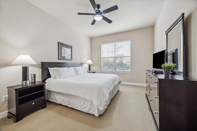 bedroom with light colored carpet and ceiling fan