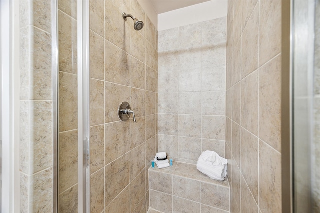 bathroom with a tile shower