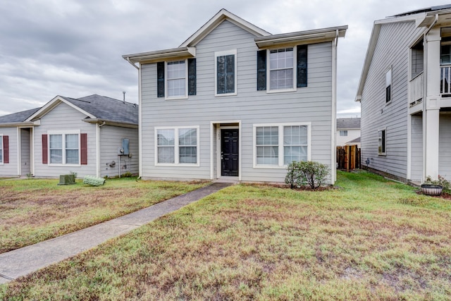 view of front of property with a front lawn and a balcony