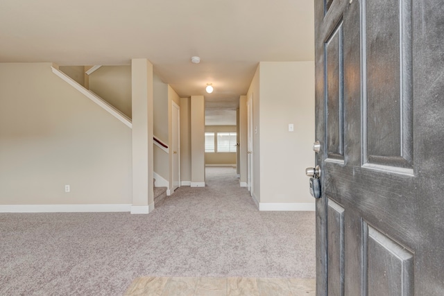 view of carpeted foyer