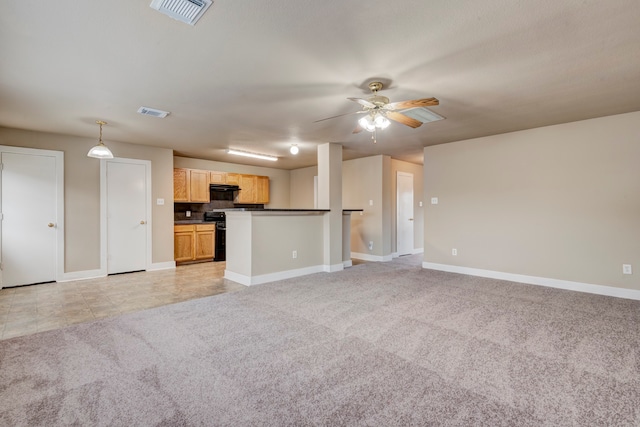 unfurnished living room featuring ceiling fan and light carpet