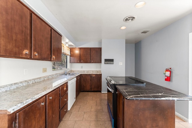 kitchen featuring dishwasher, dark brown cabinets, sink, electric range, and light tile patterned floors