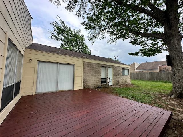 wooden terrace with a yard