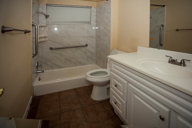 bathroom with vanity, toilet, and tile patterned floors