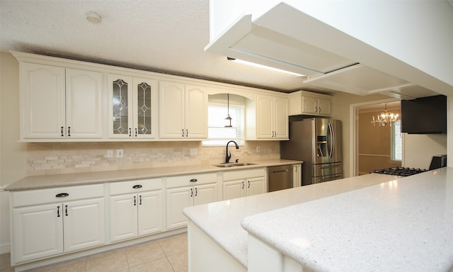 kitchen with white cabinetry, sink, and appliances with stainless steel finishes