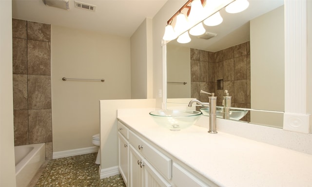 full bathroom with  shower combination, vanity, and toilet