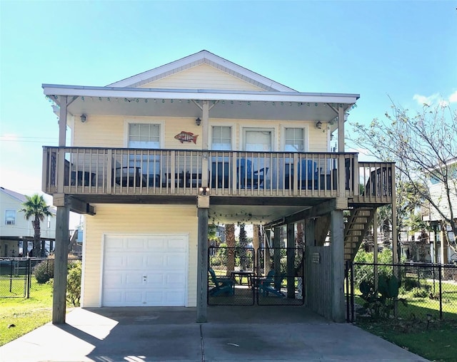 4034 Panola Dr, Galveston, TX 77554 - raised beach house featuring an attached garage, a carport, driveway, stairs, and a porch