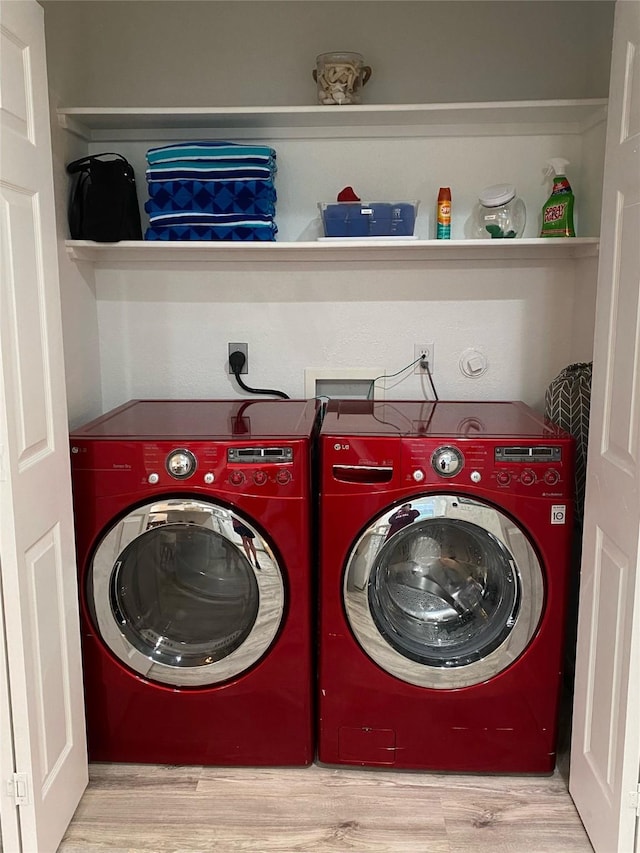 4034 Panola Dr, Galveston, TX 77554 - laundry area featuring washer and clothes dryer and wood finished floors