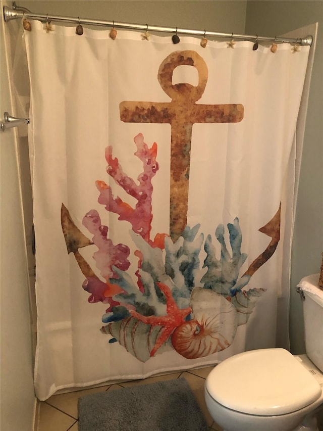 4034 Panola Dr, Galveston, TX 77554 - full bath with tile patterned flooring, toilet, and a shower with curtain