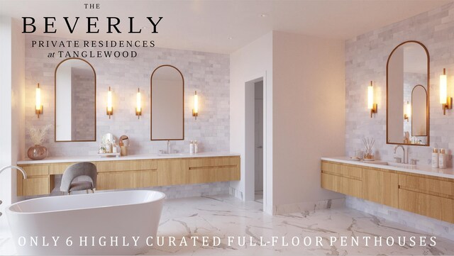 bathroom featuring vanity, a bathtub, and tile walls