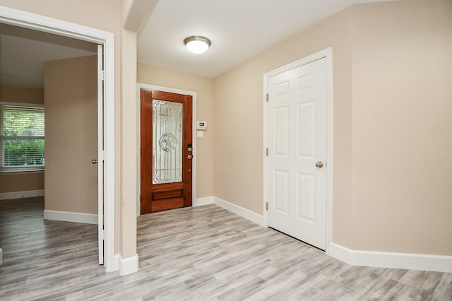 foyer entrance with light wood-type flooring