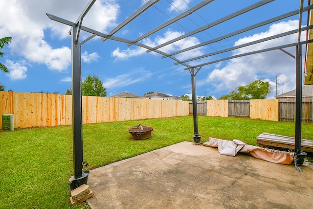 view of patio / terrace with a fire pit and a pergola