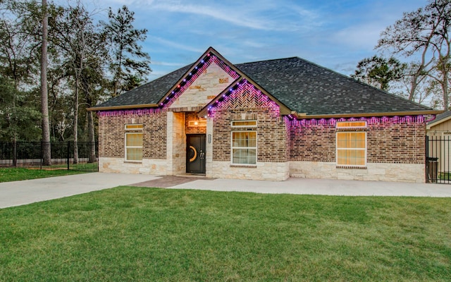 view of front of house with a patio area and a front yard