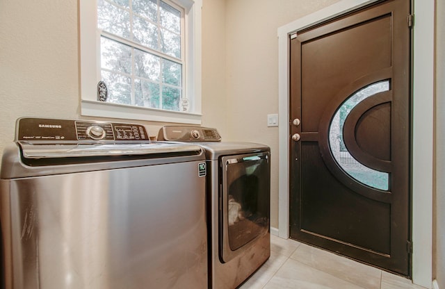 washroom with washing machine and dryer