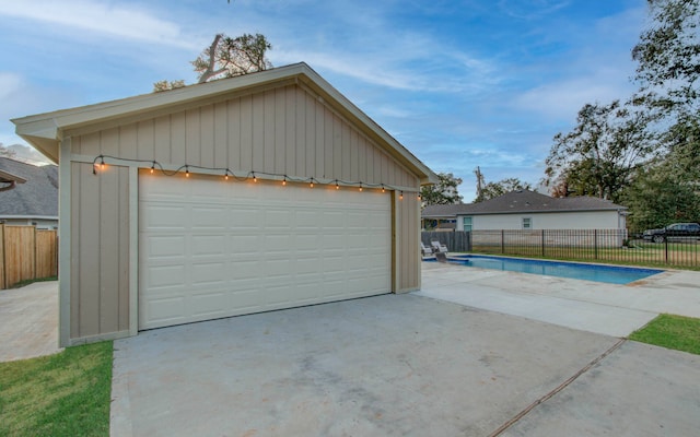 garage featuring a fenced in pool