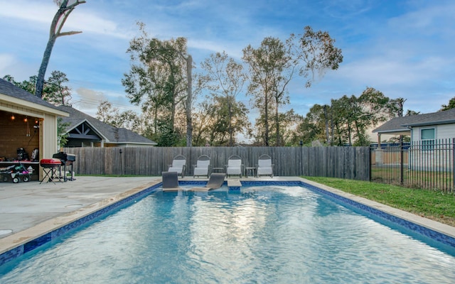 view of swimming pool featuring a patio area