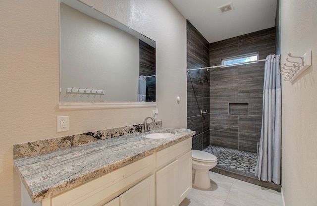 bathroom featuring toilet, a shower with curtain, and vanity