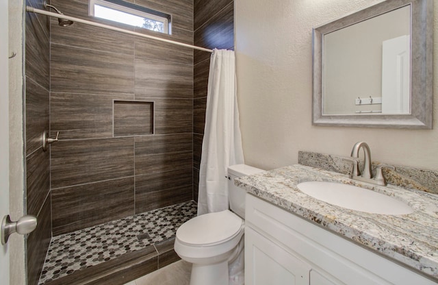 bathroom with vanity, hardwood / wood-style floors, curtained shower, and toilet