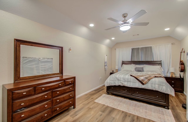 bedroom with lofted ceiling, light wood-type flooring, and ceiling fan