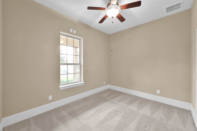 unfurnished room with ceiling fan and light colored carpet