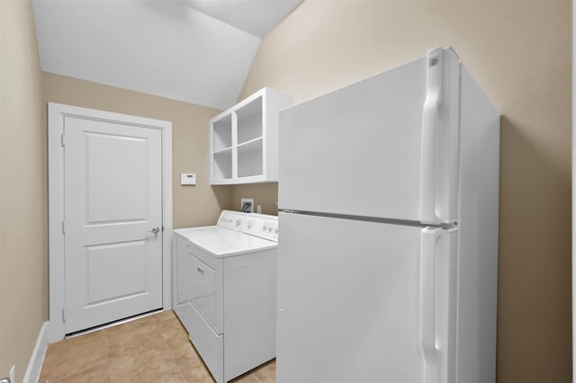 washroom with washer / dryer