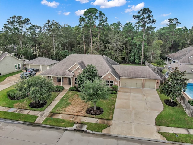 view of front facade with a front lawn and a garage