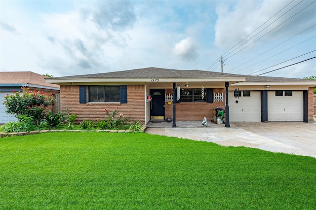 single story home with a front yard and a garage