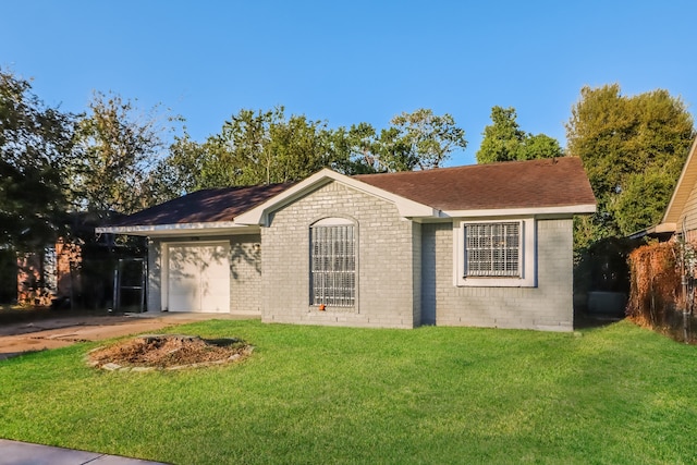 single story home with a garage and a front lawn