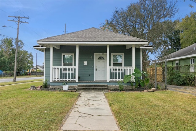 bungalow-style house with a front yard and a porch