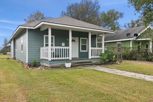 bungalow-style home featuring a porch and a front lawn