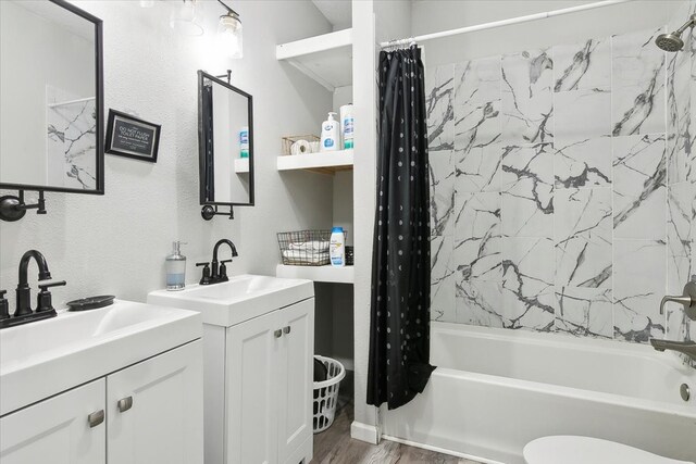 full bathroom featuring vanity, toilet, shower / bathtub combination with curtain, and wood-type flooring