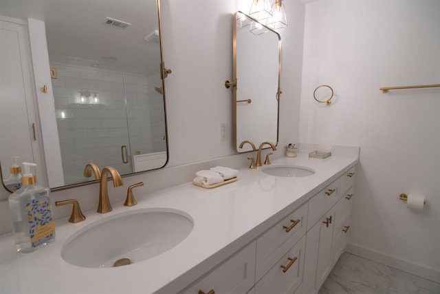 bathroom featuring vanity and a shower with shower door