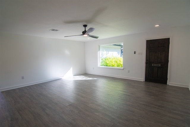 unfurnished room featuring ceiling fan and dark hardwood / wood-style floors