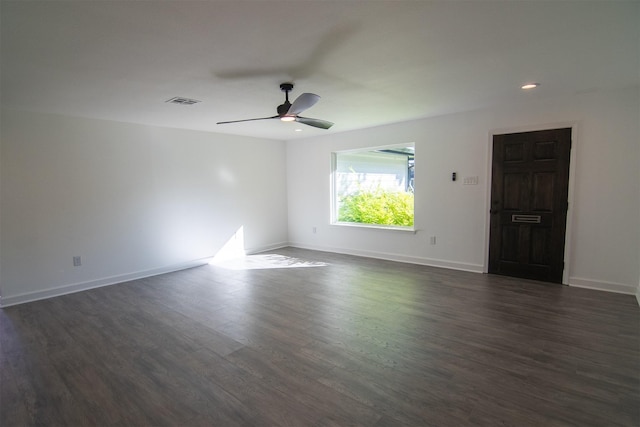 unfurnished room featuring visible vents, baseboards, a ceiling fan, dark wood-style flooring, and recessed lighting