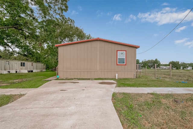 view of property exterior with a lawn