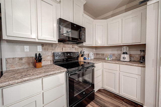 kitchen with white cabinetry, black appliances, ornamental molding, and dark wood-type flooring