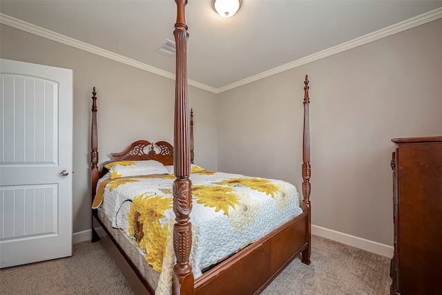 bedroom with crown molding and carpet flooring