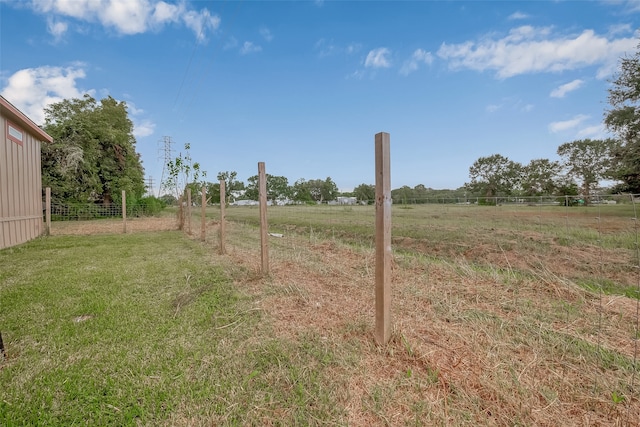 view of yard with a rural view