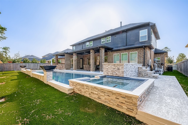 rear view of property featuring a patio, a lawn, cooling unit, and a swimming pool with hot tub