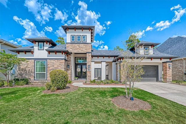 view of front of property with a garage and a front yard