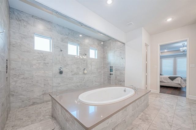 bathroom featuring plenty of natural light and shower with separate bathtub