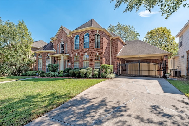 view of front of home featuring central AC unit, a carport, and a front yard