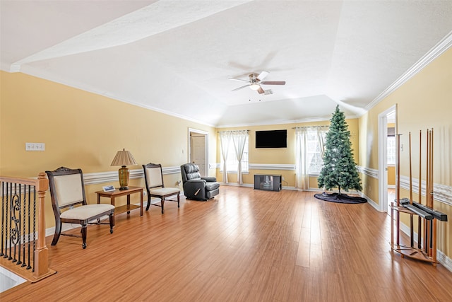 sitting room featuring hardwood / wood-style flooring, ceiling fan, a textured ceiling, lofted ceiling, and crown molding