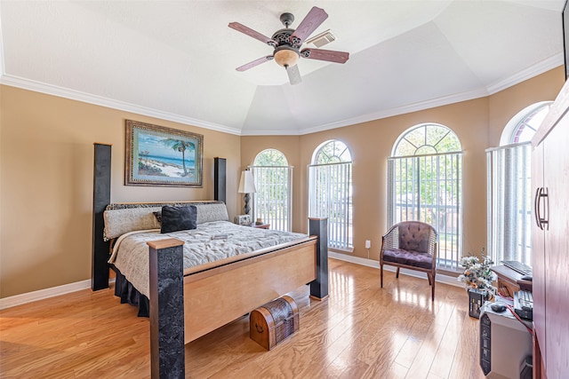 bedroom with ceiling fan, light wood-type flooring, lofted ceiling, and ornamental molding