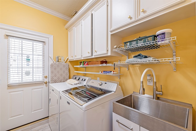 laundry area with cabinets, separate washer and dryer, sink, crown molding, and light wood-type flooring