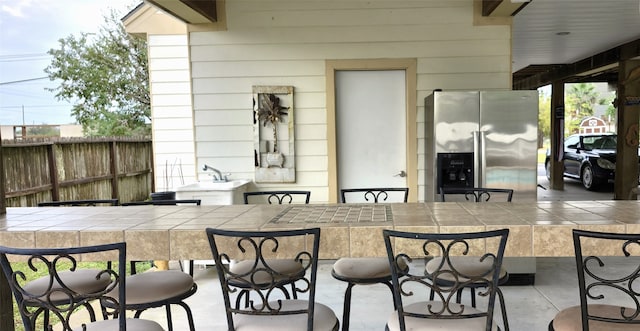 view of patio featuring a bar