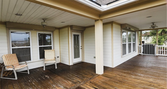 wooden deck with ceiling fan