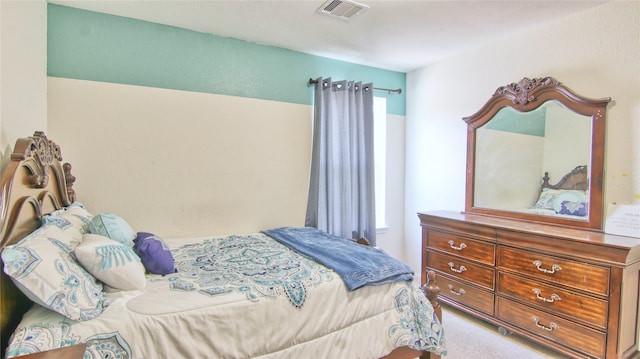 carpeted bedroom featuring multiple windows